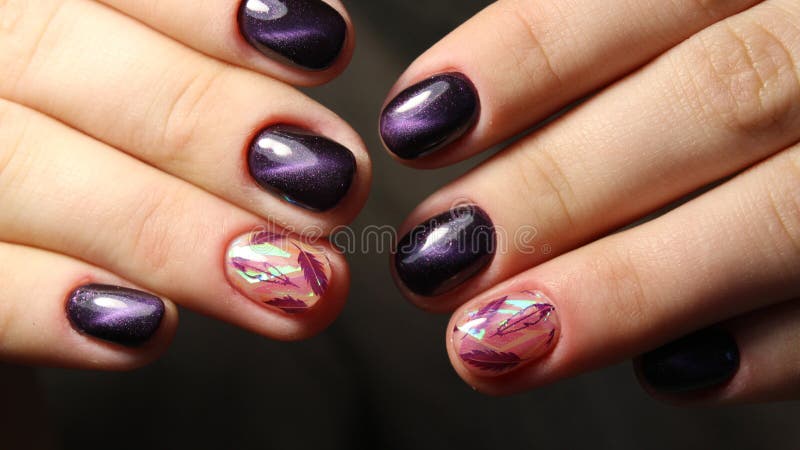 Manicure nail design cat`s eye, feathers. Manicure nail design cat`s eye, feathers