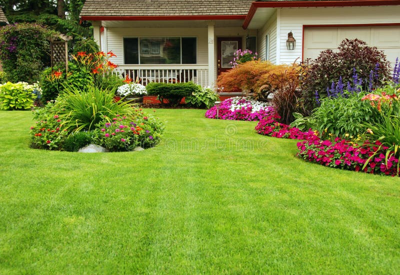 A finely manicured yard shows its summer colors. A finely manicured yard shows its summer colors.