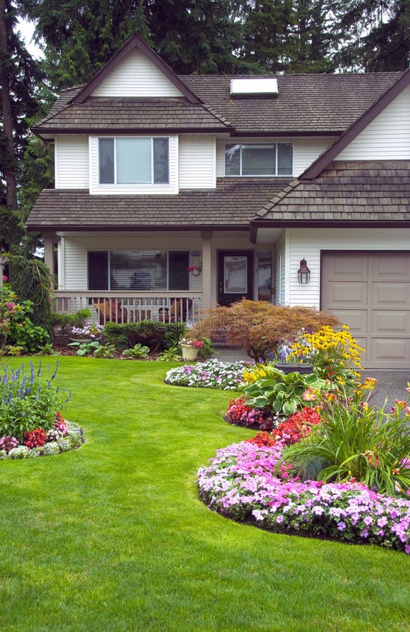 A well kept home with a colourful perennial and annual garden. A well kept home with a colourful perennial and annual garden.