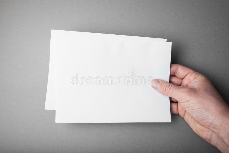 Manifesto dell'aletta di filatoio dello spazio in bianco del modello a disposizione su grigio per sostituire la vostra progettazi fotografia stock libera da diritti Manifesto dell'aletta di filatoio dello spazio in bianco del modello a disposizione su grigio per sostituire la vostra progettazi fotografia stock libera da diritti
