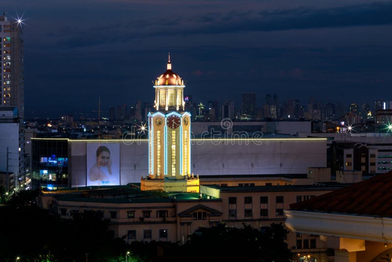 The clock tower of the Manila City Hall at night view from Intamurose district, Manila