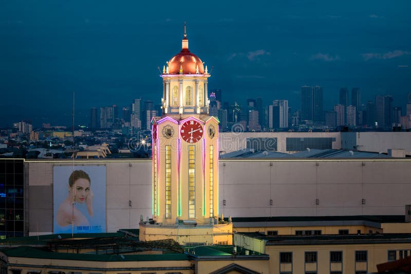 The clock tower of the Manila City Hall at night view from Intamurose district, Manila