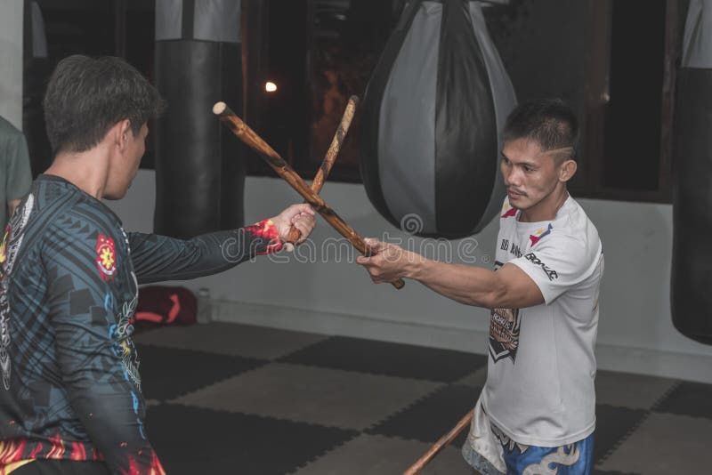 Filipino Martial Arts Instructor Demonstrates Stick Fighting Techniques  Stock Photo - Image of astig, outdoor: 109278684