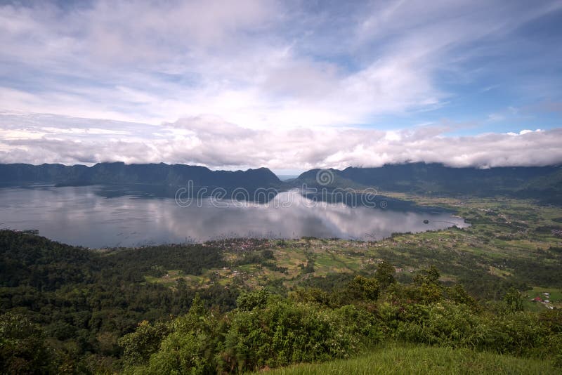 The Maninjau caldera was formed by a volcanic eruption estimated to have occurred around 52,000 years ago. Deposits from the eruption have been found in a radial distribution around Maninjau extending up to 50 kilometres 31 mil to the east, 75 kilometres 47 mil to the southeast, and west to the present coastline. The deposits are estimated to be distributed over 8,500 square kilometres 3,300 sq ml and have a volume of 220–250 cubic kilometres 53–60 cu mi. The caldera has a length of 20 kilometres 12 mi and a width of 8 kilometres 5.0 ml. The Maninjau caldera was formed by a volcanic eruption estimated to have occurred around 52,000 years ago. Deposits from the eruption have been found in a radial distribution around Maninjau extending up to 50 kilometres 31 mil to the east, 75 kilometres 47 mil to the southeast, and west to the present coastline. The deposits are estimated to be distributed over 8,500 square kilometres 3,300 sq ml and have a volume of 220–250 cubic kilometres 53–60 cu mi. The caldera has a length of 20 kilometres 12 mi and a width of 8 kilometres 5.0 ml