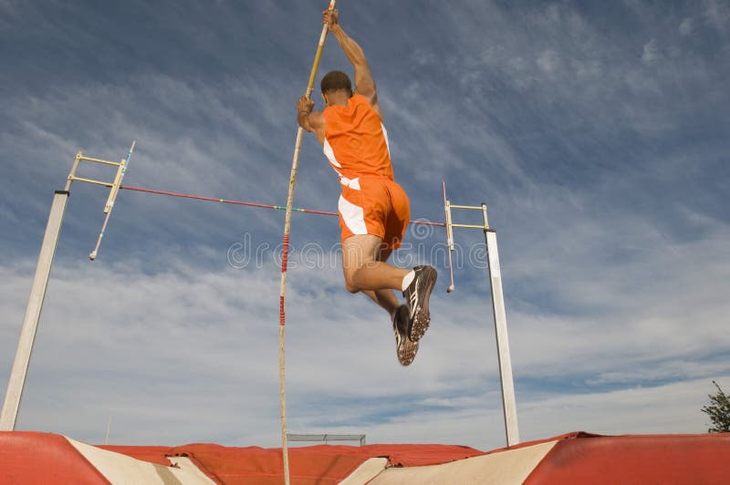 Manlig idrottsman nen Pole Vaulting arkivfoto
