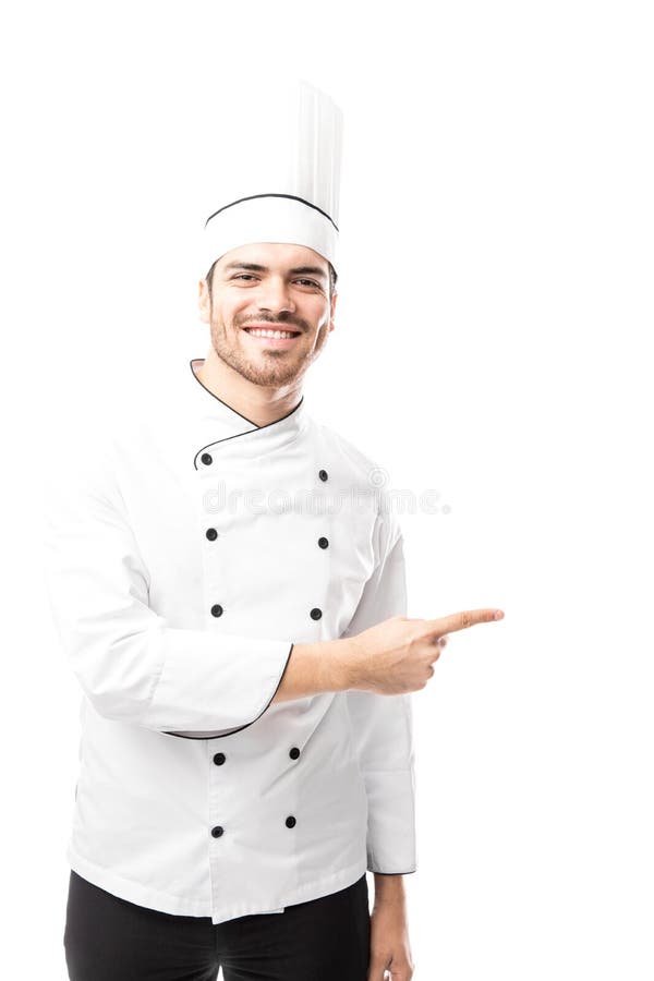 Manlig kock som pekar för att kopiera utrymme royaltyfri fotografi Manlig kock som pekar för att kopiera utrymme royaltyfri fotografi