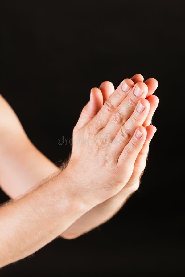 Manligt be för hand arkivfoto Manligt be för hand arkivfoto
