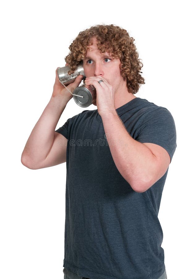 Mann, der Blechdosetelefon verwendet stockfotos Mann, der Blechdosetelefon verwendet stockfotos