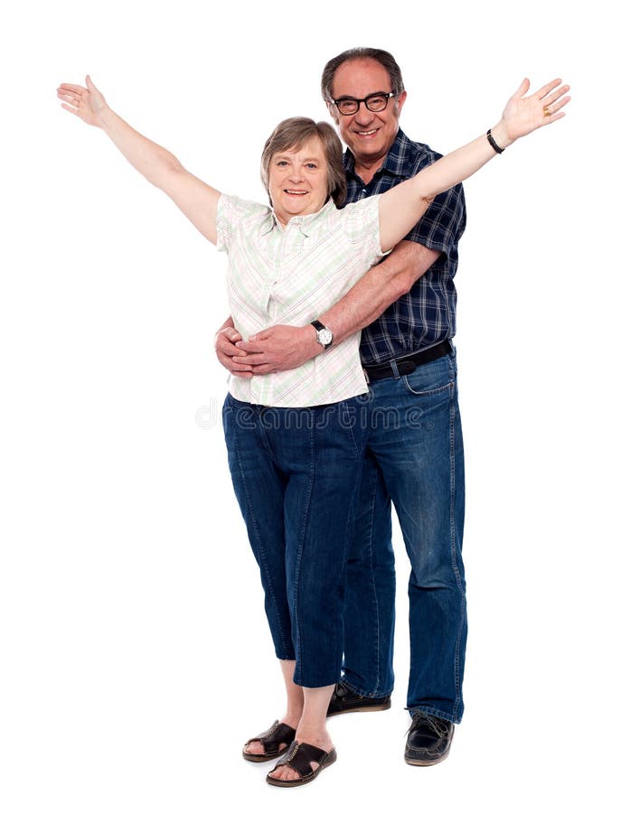 Mann, der seine Frau von hinten umarmt lizenzfreie stockfotografie Mann, der seine Frau von hinten umarmt lizenzfreie stockfotografie
