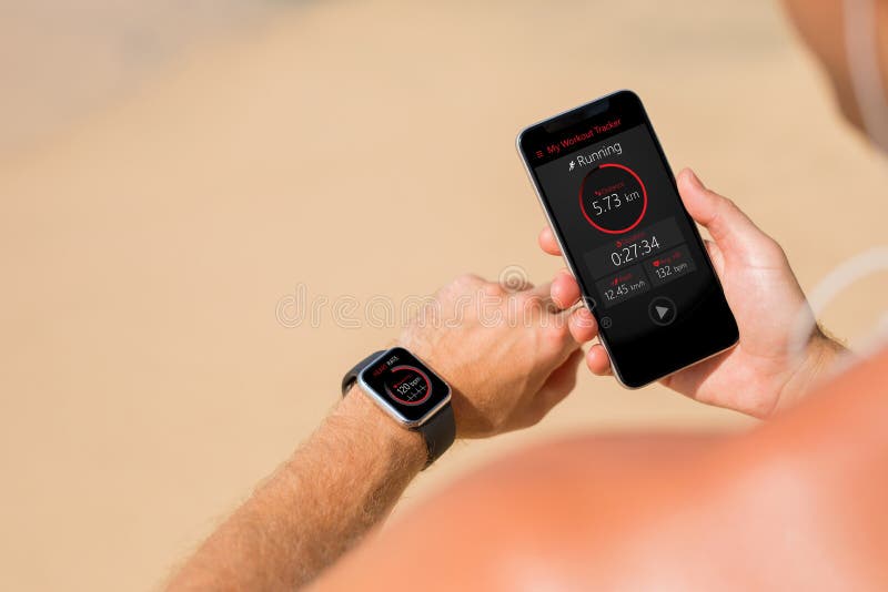 Man using wearable tech during fitness workout, man before workout on the beach. Man using wearable tech during fitness workout, man before workout on the beach