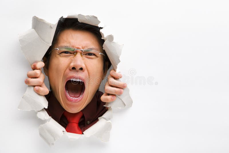Man screaming from the hole in wall with copy space in horizontal position. Man screaming from the hole in wall with copy space in horizontal position