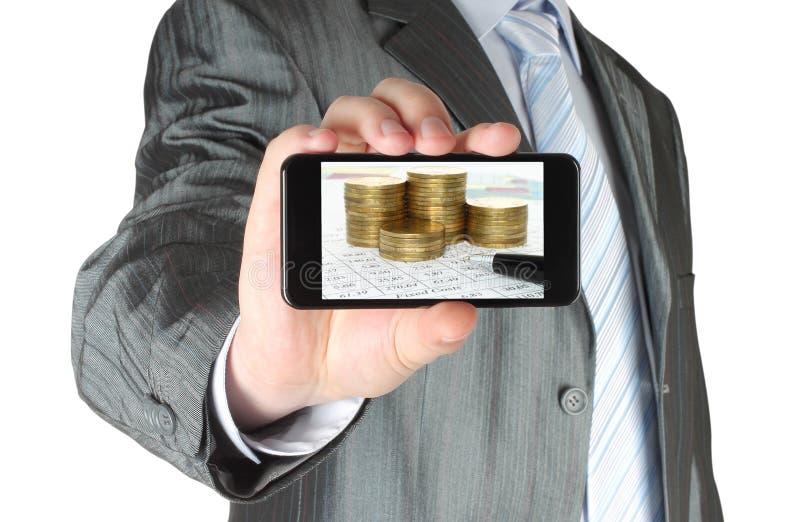 Mann hält intelligentes Telefon mit Geschäftszusammensetzung von Diagrammen und von Geld lizenzfreies stockbild Mann hält intelligentes Telefon mit Geschäftszusammensetzung von Diagrammen und von Geld lizenzfreies stockbild