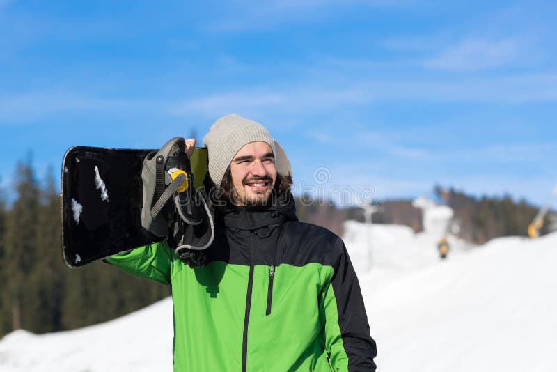 Mann touristischer Snowboard Ski Resort Snow Winter Mountain glücklicher lächelnder Guy On Holiday stockbild Mann touristischer Snowboard Ski Resort Snow Winter Mountain glücklicher lächelnder Guy On Holiday stockbild