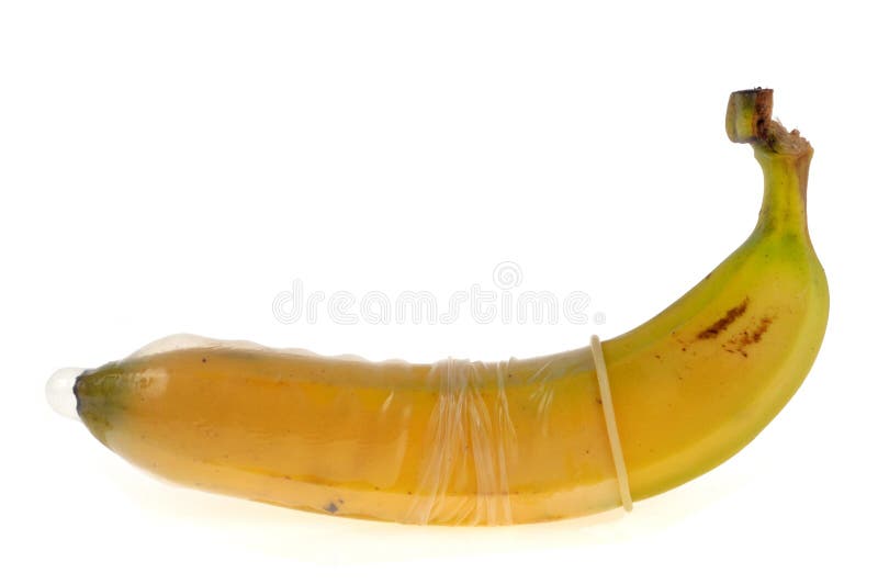 Mannelijk condoom gezet op een banaan royalty-vrije stock afbeelding Mannelijk condoom gezet op een banaan royalty-vrije stock afbeelding