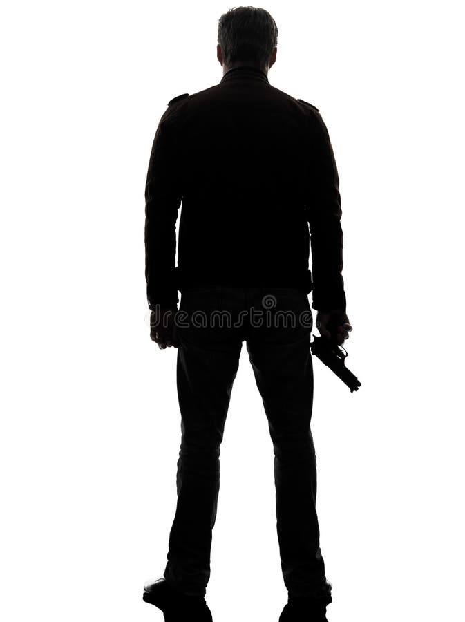 Mannmörderpolizist, der gehendes Schattenbild des Gewehrs hält