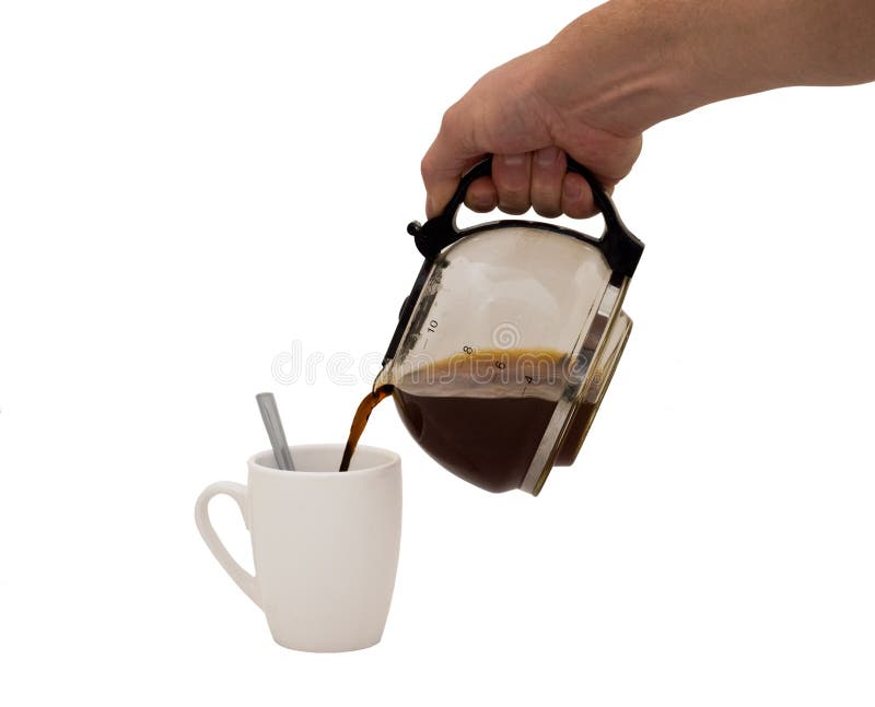An isolated over white image of a caucasian man's hand holding and pouring coffee into a white mug complete with spoon. An isolated over white image of a caucasian man's hand holding and pouring coffee into a white mug complete with spoon.