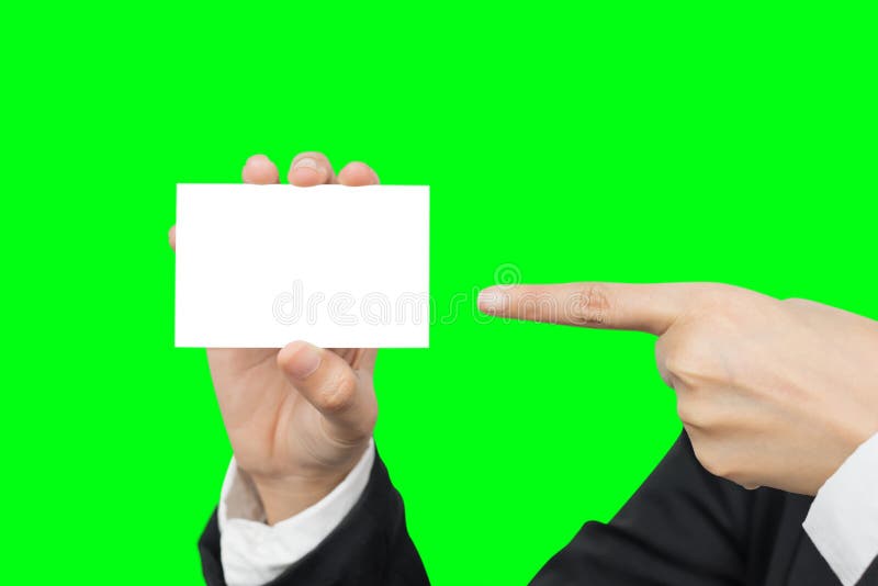 Mano che tiene e che indica biglietto da visita in bianco fotografia stock Mano che tiene e che indica biglietto da visita in bianco fotografia stock