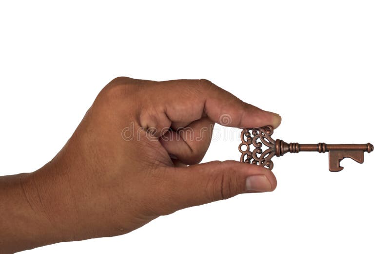 Mano che tiene la chiave fotografia stock Mano che tiene la chiave fotografia stock