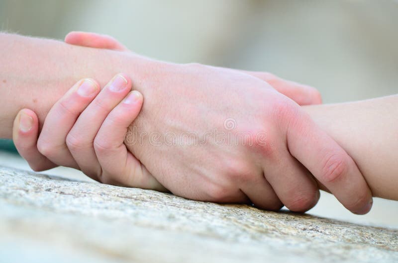 Mano Clasped per guida immagine stock libera da diritti Mano Clasped per guida immagine stock libera da diritti