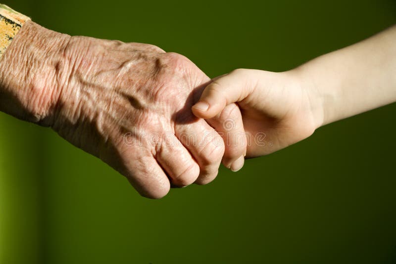 Hand of old woman and child - generations. Hand of old woman and child - generations