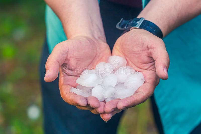 Man hand holding a hail after hailstorm in Lithuania. Man hand holding a hail after hailstorm in Lithuania