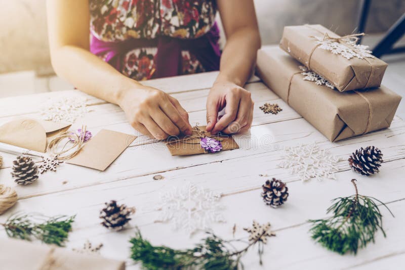 Woman hand making beautiful Christmas card at table. Woman hand making beautiful Christmas card at table.