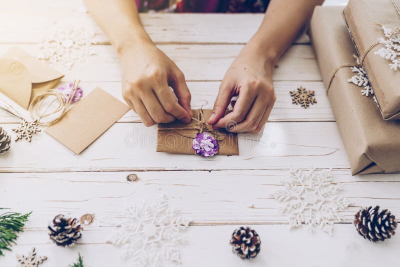 Woman hand making beautiful Christmas card at table. Woman hand making beautiful Christmas card at table.