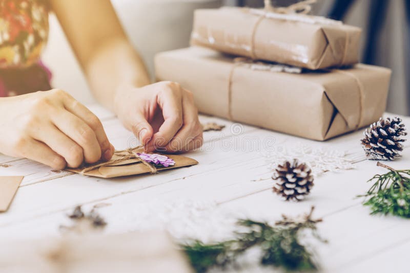 Woman hand making beautiful Christmas card at table. Woman hand making beautiful Christmas card at table.