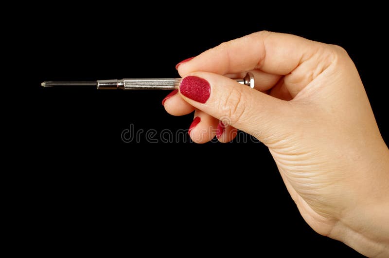 Mano della donna che tiene il cacciavite di philips immagine stock Mano della donna che tiene il cacciavite di philips immagine stock