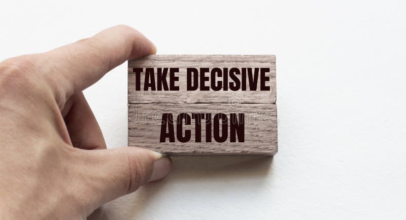 Hand of a businessman holding wooden blocks. Conceptual image. Text TAKE DECISIVE ACTION concept business succeed. Hand of a businessman holding wooden blocks. Conceptual image. Text TAKE DECISIVE ACTION concept business succeed.