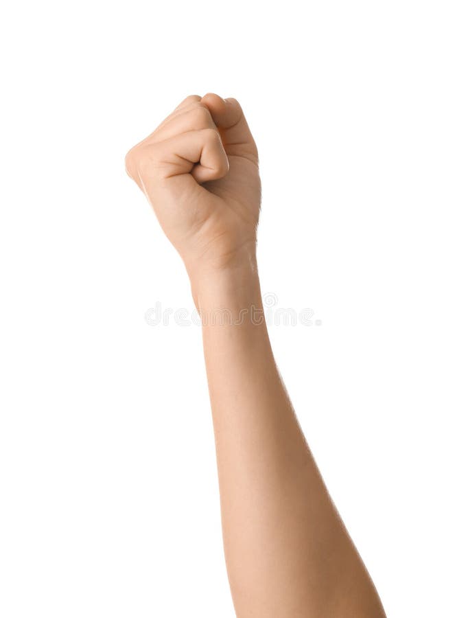 Mano femenina con el puño apretado en el fondo blanco fotografía de archivo libre de regalías Mano femenina con el puño apretado en el fondo blanco fotografía de archivo libre de regalías