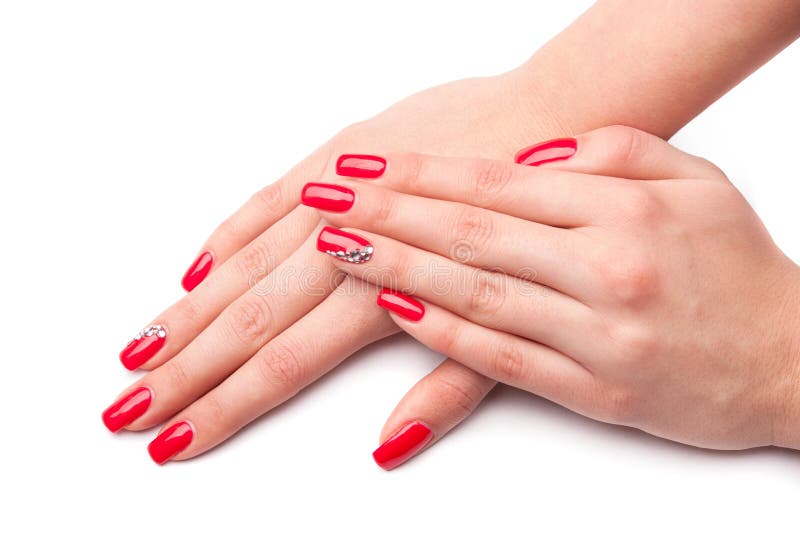 Mano femenina hermosa con los clavos rojos aislados en blanco imagenes de archivo Mano femenina hermosa con los clavos rojos aislados en blanco imagenes de archivo