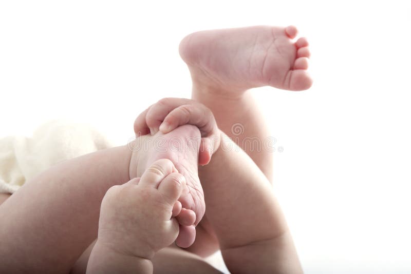 Mano, gambe e piede di braccia del bambino immagini stock libere da diritti Mano, gambe e piede di braccia del bambino immagini stock libere da diritti