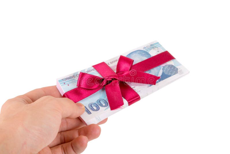 Mano que sostiene billetes de banco de la lira turca con la cinta como regalo imágenes de archivo libres de regalías Mano que sostiene billetes de banco de la lira turca con la cinta como regalo imágenes de archivo libres de regalías