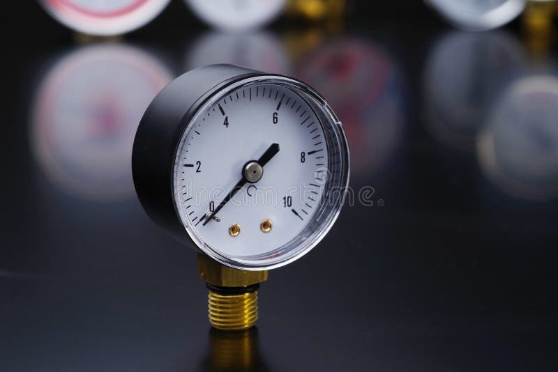 Manometer in Focus. a Pressure Gauge on the Background of Other
