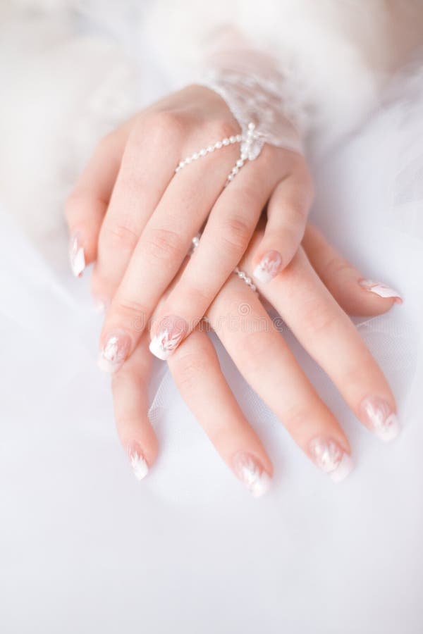 Beautiful bride's hands with manicure in white gloves. Beautiful bride's hands with manicure in white gloves