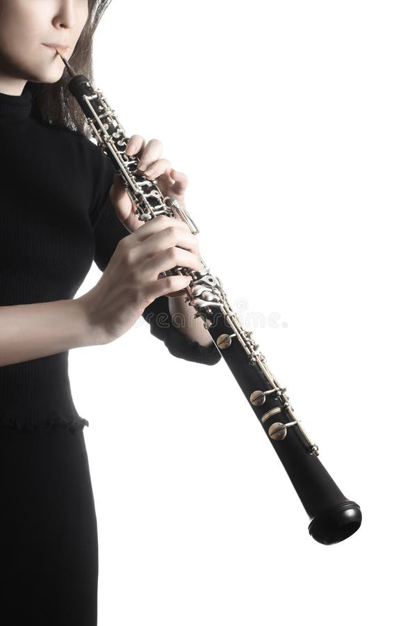 Manos del jugador del oboe que tocan el instrumento musical imagen de archivo libre de regalías Manos del jugador del oboe que tocan el instrumento musical imagen de archivo libre de regalías