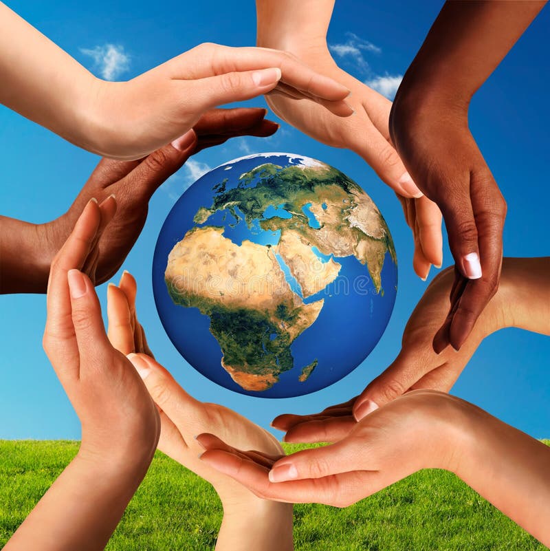 Conceptual peace and cultural diversity symbol of multiracial hands making a circle together around the world the Earth globe on blue sky and green grass background. Conceptual peace and cultural diversity symbol of multiracial hands making a circle together around the world the Earth globe on blue sky and green grass background.