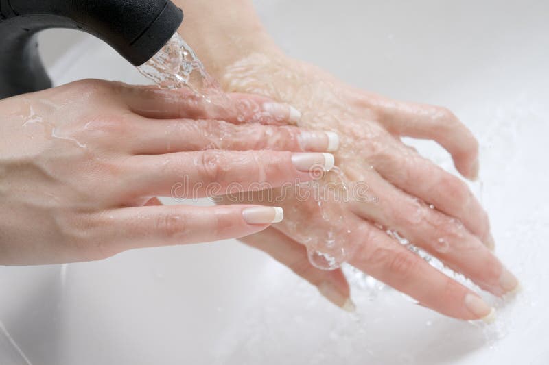 Woman washing hands in water. Woman washing hands in water