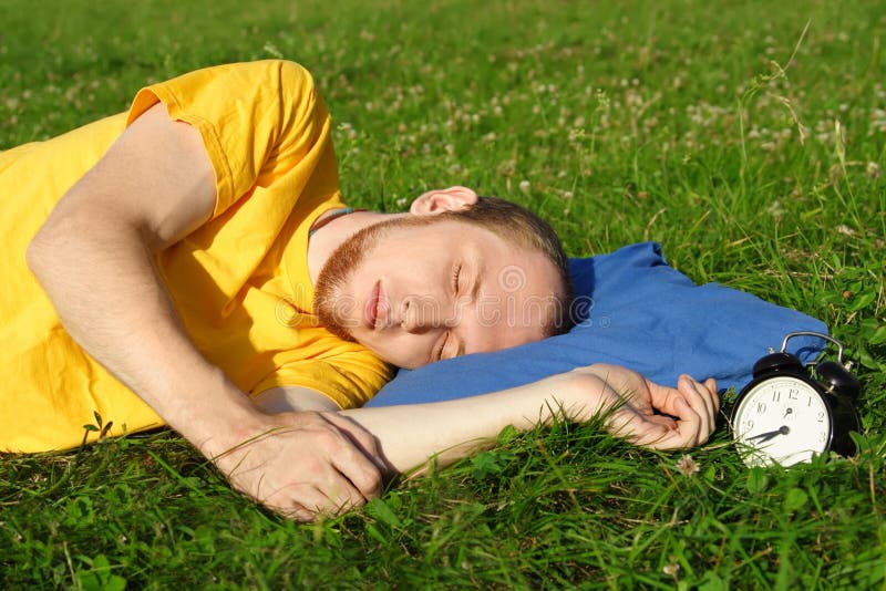 Mansleeping in summer meadow