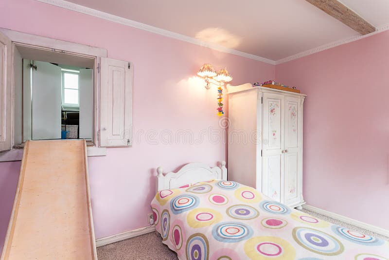 Vintage mansion - a pink room with a slide and a bed. Vintage mansion - a pink room with a slide and a bed