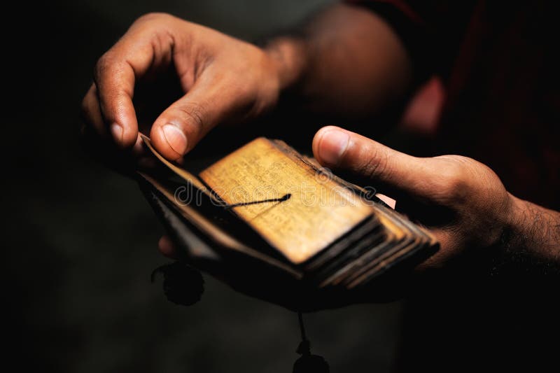 Ancient tibetan buddhist text in the hands of Brahman monk. Brahman stock images, royalty-free photos and pictures