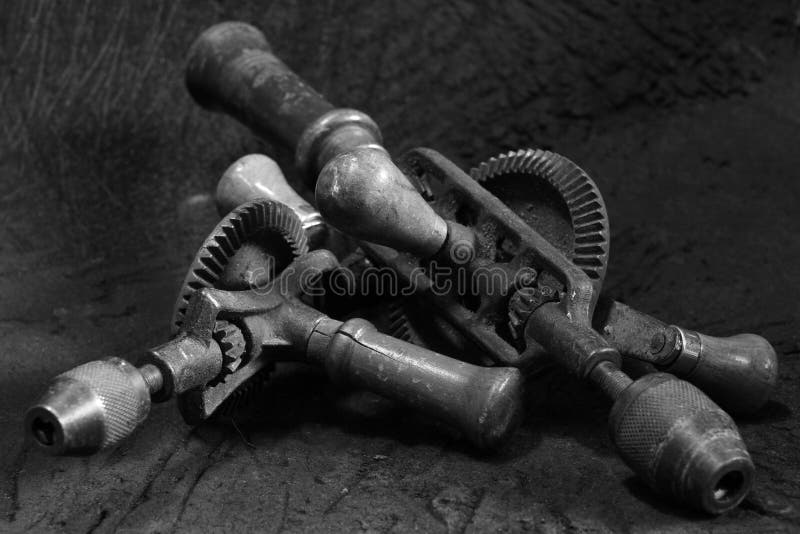 Antique Oldstyle Manual Hand Drill in Black and White Image Stock