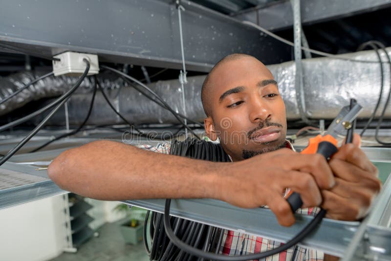 Manual worker inspecting ceiling royalty free stock photos
