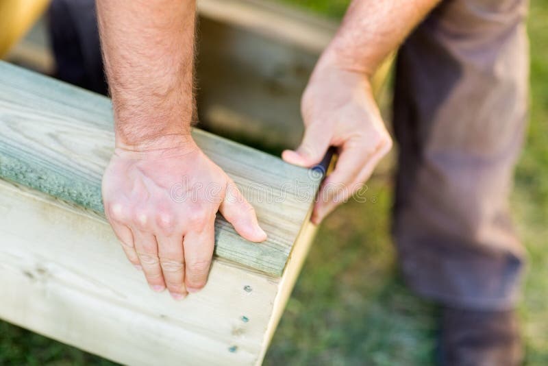 Manual Worker s Hand Fixing Wood At Site