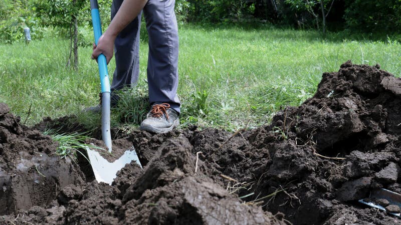 Deep Dirt Hole In Ground Or Lawn Stock Photo - Download Image Now