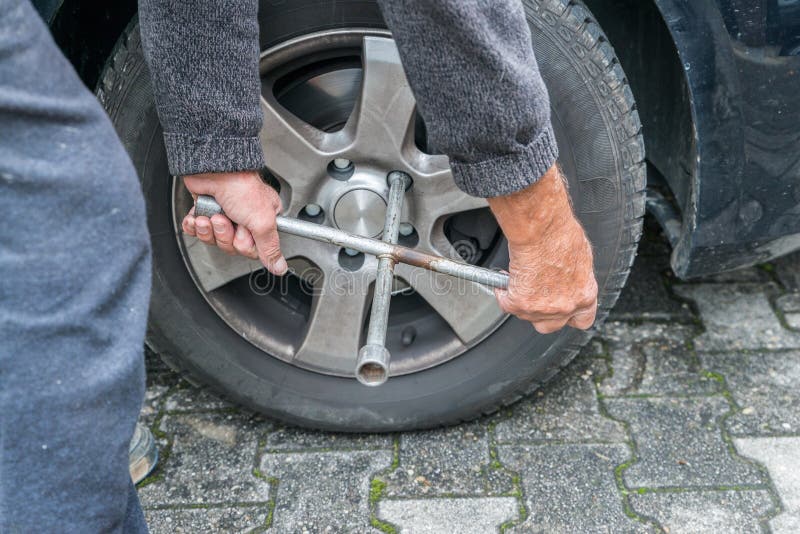 Manually Tire Change with Fourway Socket Wrench Stock Photo Image of