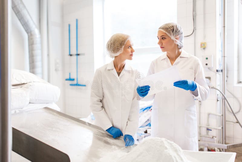 Women technologists working at ice cream factory royalty free stock photo Women technologists working at ice cream factory royalty free stock photo