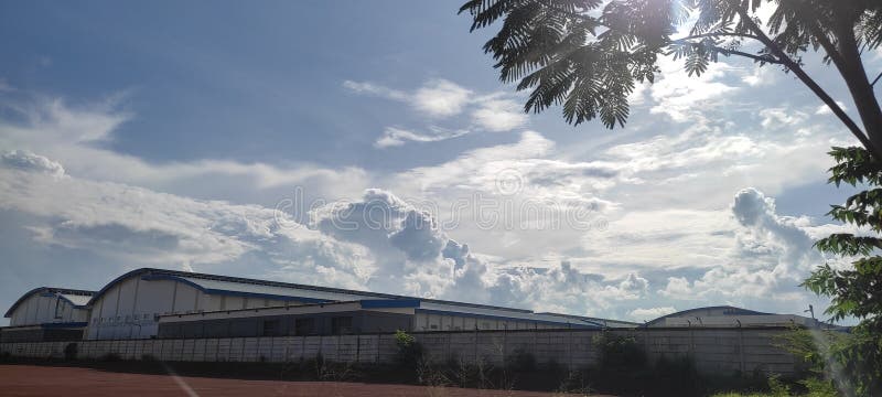 an electronics factory that takes shelter under a beautiful cloud. an electronics factory that takes shelter under a beautiful cloud