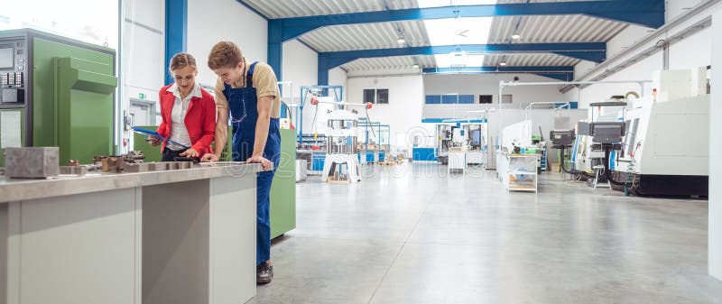 Manufacturing worker and manager during quality inspection stock photos